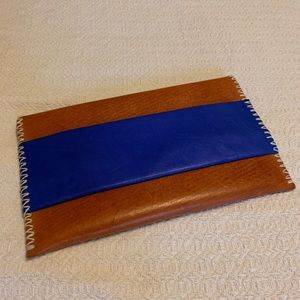 Noonday leather clutch